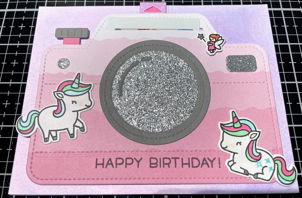 Birthday card with a camera, unicorns, a fairy, and a tab that pulls up to reveal an Instax photo of two toddlers using Lawn Fawn Magic Iris Camera Pull Tab Add-On and Unicorn Picnic stamp and die sets
