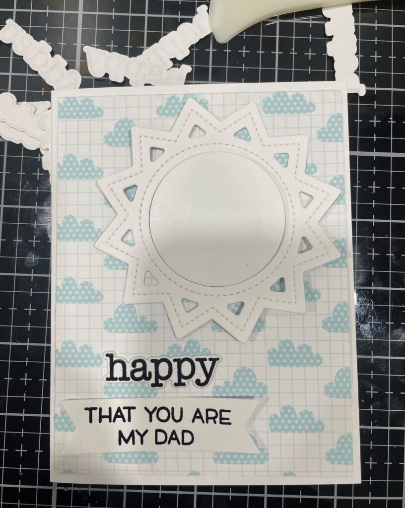Card with cloud patterned paper, white sun die cut, and sentiment that says "Happy that you are my dad"
