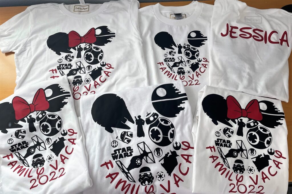 Five shirts with Mickey and Minnie Mouse ears and Mandalorian themed pictures and one shirt showing personalized back of shirt